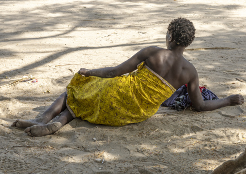 Woman resting on the ground, Nampula Province, Island of Mozambique, Mozambique