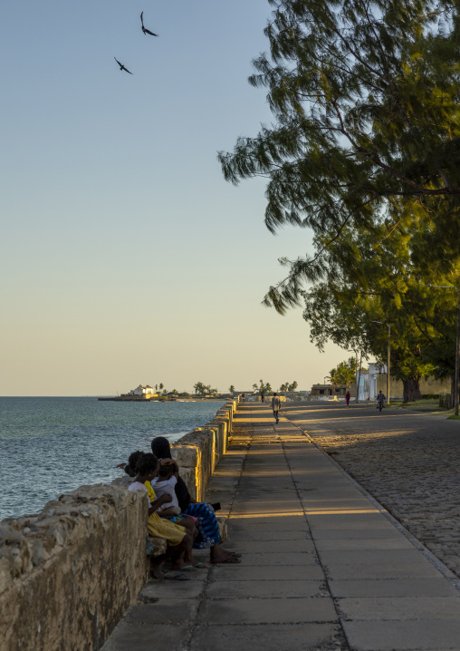 People relaxing along the corniche, Nampula Province, Island of Mozambique, Mozambique