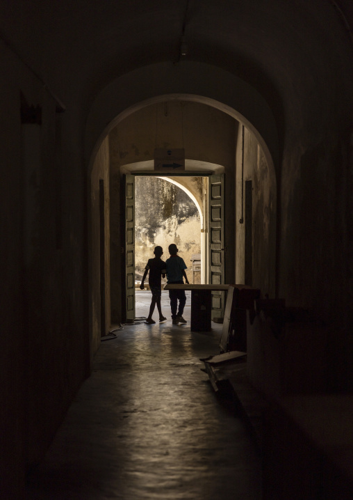 Silhouettes of two boys in a doorway, Nampula Province, Island of Mozambique, Mozambique