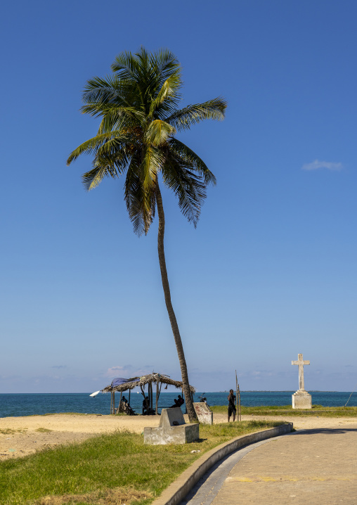 Men under a shelter neat a cross, Nampula Province, Island of Mozambique, Mozambique