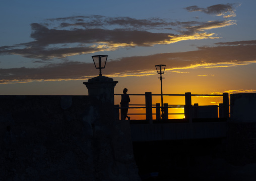 Silhouette on the jetty at sunset, Nampula Province, Island of Mozambique, Mozambique