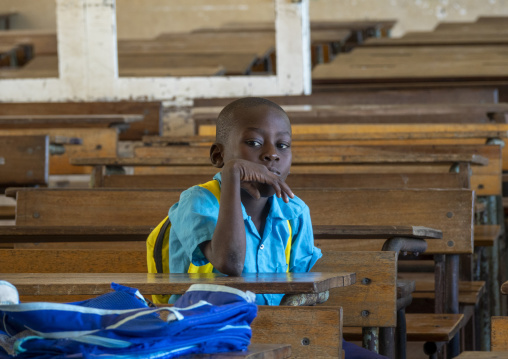 Portrait of a boy alone in a classroom, Nampula Province, Island of Mozambique, Mozambique