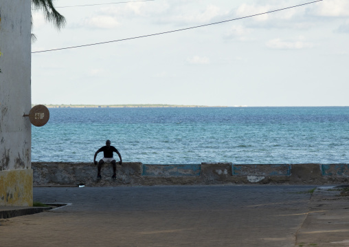 Man sit in front of the sea, Nampula Province, Island of Mozambique, Mozambique