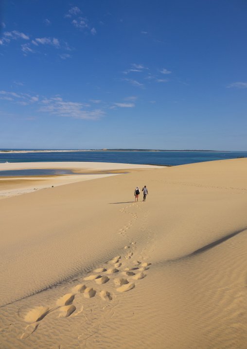 Tourists walking on sand dune in Bazaruto national park, Bazaruto archipelago, Bazaruto island, Mozambique