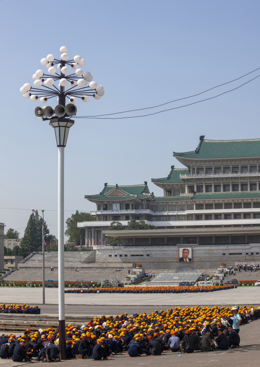 North Korean teenagers in Kim Il sung square waiting for a parade, DGC, Pyongyang, North Korea
