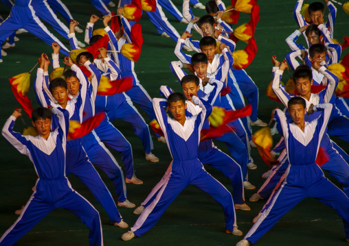 North Korean gymnasts with red flags during the Arirang mass games, DGC, Pyongyang, North Korea