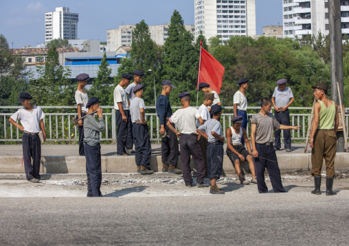 North Korean young men cleaning the road, DGC, Pyongyang, North Korea