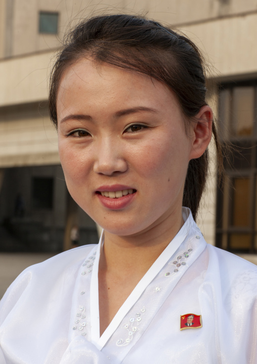 Portrait of a smiling North Korean woman in the street, DGC, Pyongyang, North Korea