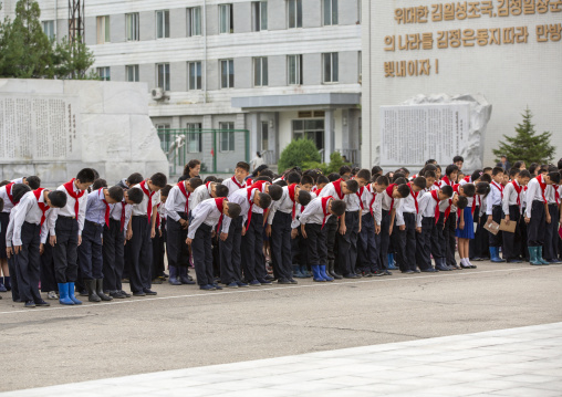 North Korean pioneers paying respect to the Leaders in Mansudae art studio, DGC, Pyongyang, North Korea