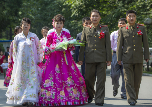 Newly wed couple in the Grand monument on Mansu hill, DGC, Pyongyang, North Korea