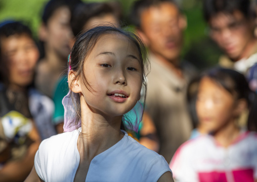 North Korean girl dancing in a park on september 9, DGC, Pyongyang, North Korea