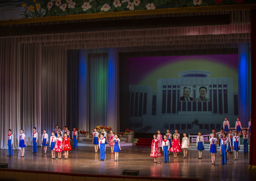 North korean pioneers singing during a show at Mangyongdae children's palace, DGC, Pyongyang, North Korea