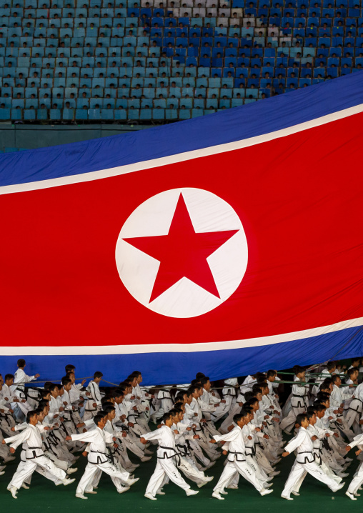 North Korean taekwondo team with a giant flag during the Arirang, DGC, Pyongyang, North Korea