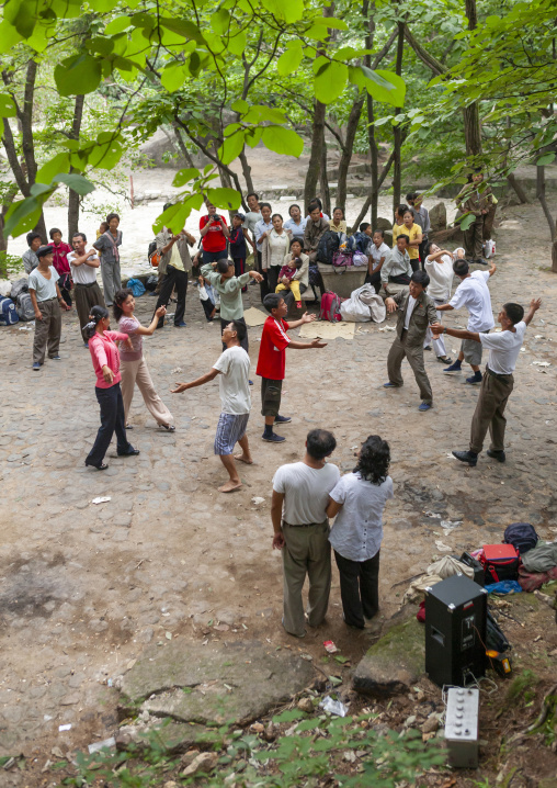 North Korean electricity company workers dancing in a park, North Hwanghae, Kaesong, North Korea
