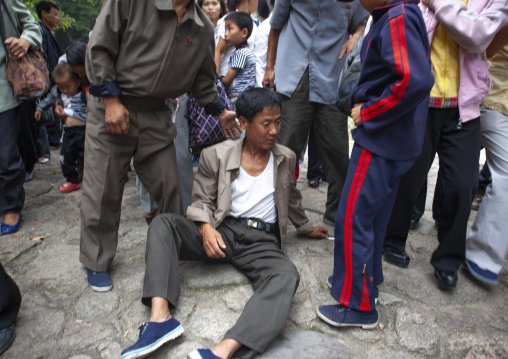 North Korean electricity company workers drunk in a park, North Hwanghae, Kaesong, North Korea