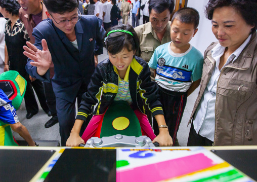 North Korean girl playing video games in Kaeson youth park, DGC, Pyongyang, North Korea