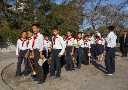 North Korean pioneers playing music in the street, Kangwon Province, Wonsan, North Korea
