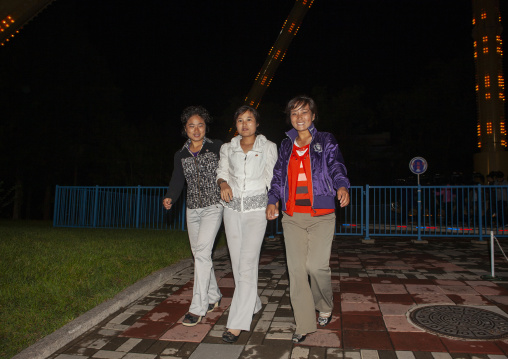 North Korean teenage girls in a park at night, DGC, Pyongyang, North Korea