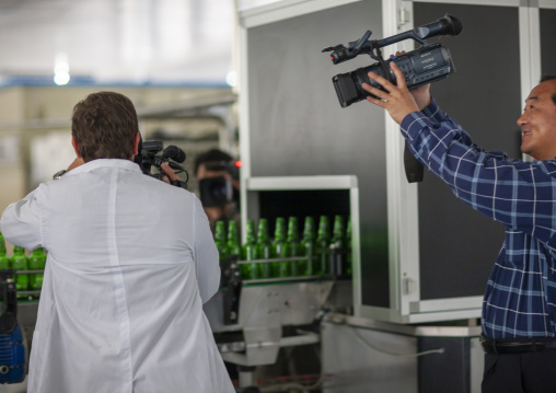 TV crew filming at kangso yaksu mineral water factory, South Pyongan, Nampo, North Korea