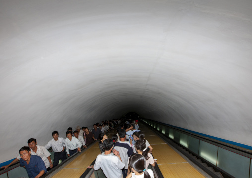 North Korean people using escalator leading to the subway station, DGC, Pyongyang, North Korea