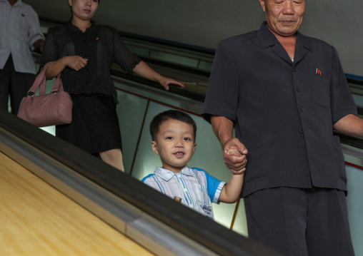 North Korean people using escalator leading to the subway station, DGC, Pyongyang, North Korea