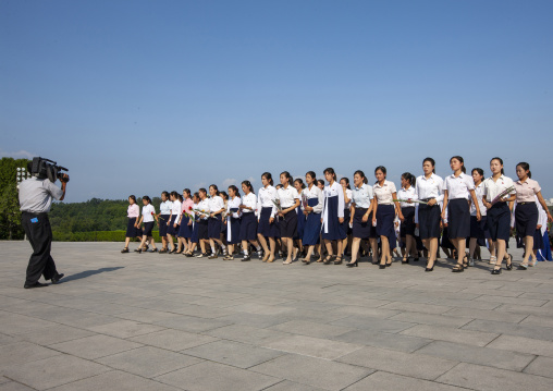 Girls paying respect to Kim il Sung statue in Mansudae Grand monument, DGC, Pyongyang, North Korea