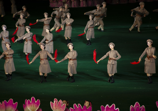 North Korean women dressed as soldiers dancing during Arirang, DGC, Pyongyang, North Korea