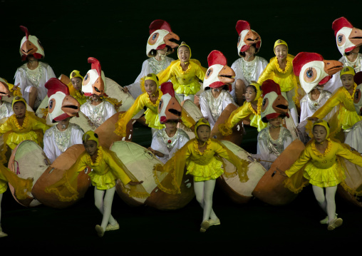 Children gymasts performing with chickens during the Arirang mass games, DGC, Pyongyang, North Korea
