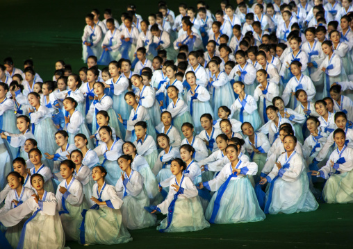 Women dancing in choson-ot during the Arirang mass games, DGC, Pyongyang, North Korea