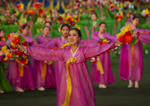 Women dancing in choson-ot during the Arirang mass games, DGC, Pyongyang, North Korea