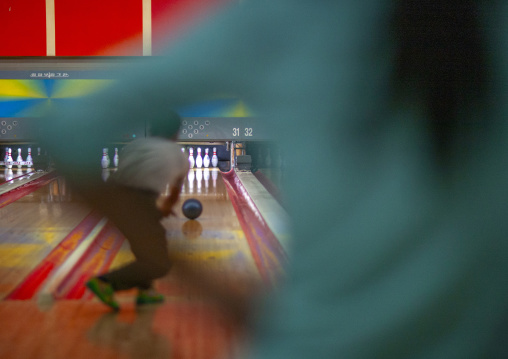 North Korean woman playing bowling, DGC, Pyongyang, North Korea
