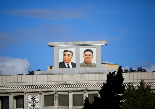 North Korean propaganda portraits with the leaders in the street, DGC, Pyongyang, North Korea