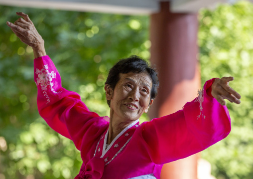 North Korean woman dancing on day of the foundation of the republic, DGC, Pyongyang, North Korea