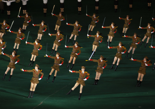 North Korean women dressed as soldiers dancing with swords in Arirang, DGC, Pyongyang, North Korea