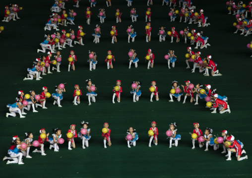 Children gymasts performing with balloons during Arirangs, DGC, Pyongyang, North Korea