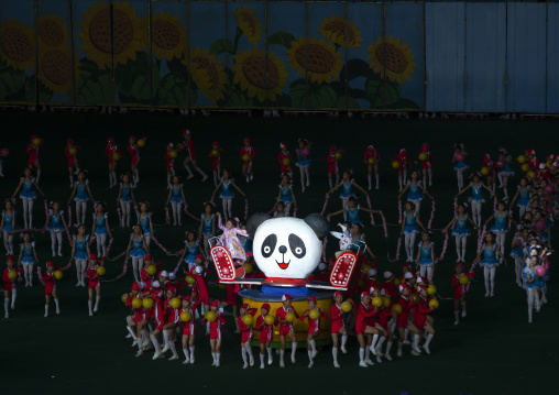 Children gymasts performing with giant panda during Arirang mass games, DGC, Pyongyang, North Korea