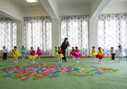 North Korean children ballet dancers in Kim Jong suk school with a teacher, DGC, Pyongyang, North Korea