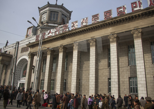 North korean people in fro,nt of the train station, DGC, Pyongyang, North Korea
