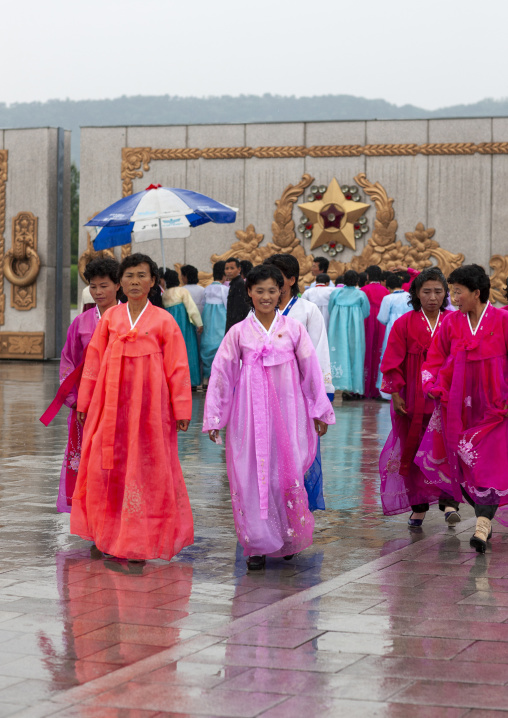 North Korean women under the rain in Kumsusan memorial palace, DGC, Pyongyang, North Korea