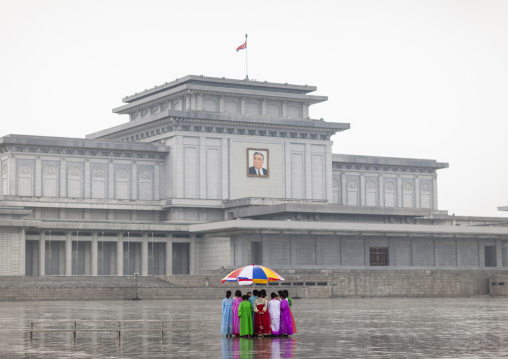 North Korean women under the rain in Kumsusan memorial palace, DGC, Pyongyang, North Korea