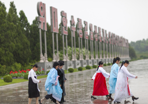 North Korean women under the rain in Kumsusan memorial palace, DGC, Pyongyang, North Korea