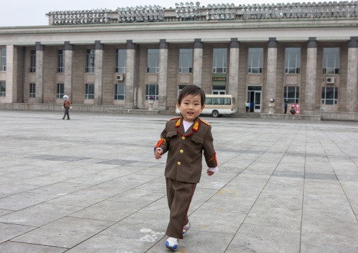 Boy dressed in soldier on Kim il Sung square, DGC, Pyongyang, North Korea