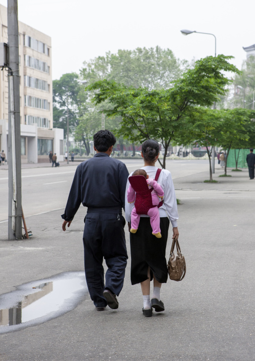 North Korean couple with a todddler in the street, DGC, Pyongyang, North Korea
