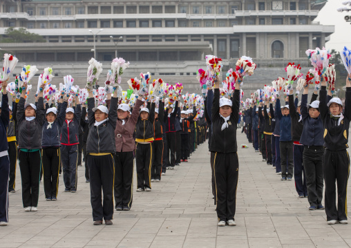 Young women during a mass games rehearsal in Kim il Sung square, DGC, Pyongyang, North Korea