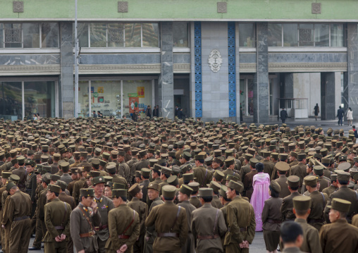 North Korean woman in pink choson-ot in the middle of soldiers, DGC, Pyongyang, North Korea