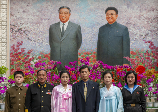 North Korean people posing in Kimilsungia and Kimjongilia festival, DGC, Pyongyang, North Korea