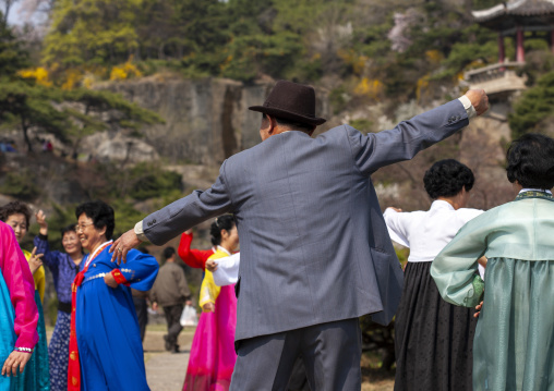 People dancing in a park for the day of the sunP, DGC, Pyongyang, North Korea
