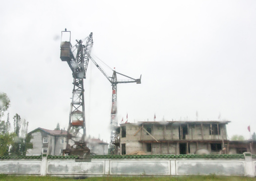 Cranes on a building site construction, South Hamgyong, Hamhung, North Korea