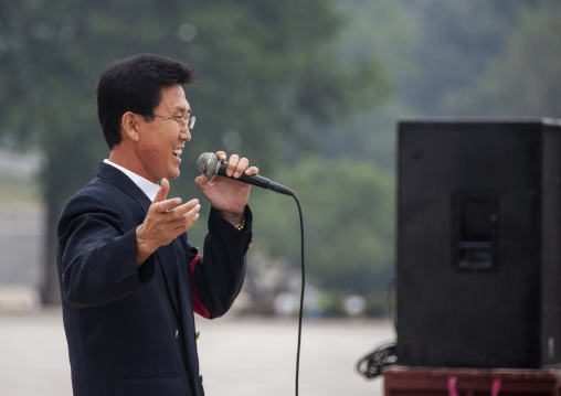 North Korean singer on national day in the street, DGC, Pyongyang, North Korea