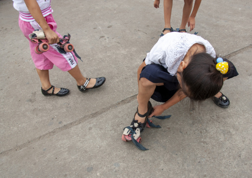 North Korean children roller skating in town, DGC, Pyongyang, North Korea